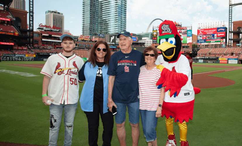 The Lathrop family poses with Fredbird at Busch Stadium.