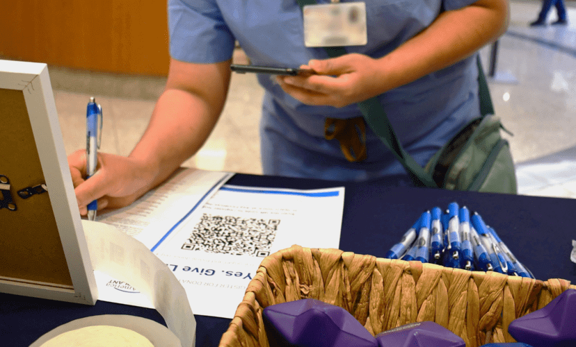 A hospital employee signs up to be an organ and tissue donor on the donor registry